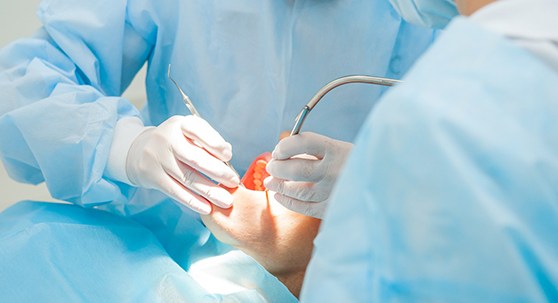 dentist performing dental surgery