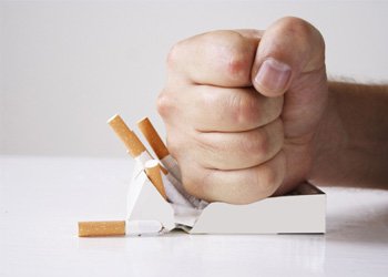 Man crushing cigarettes