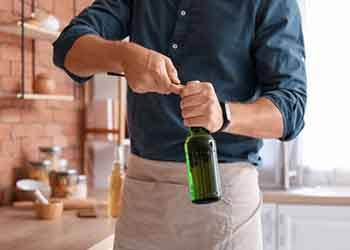 Man uses bottle opener